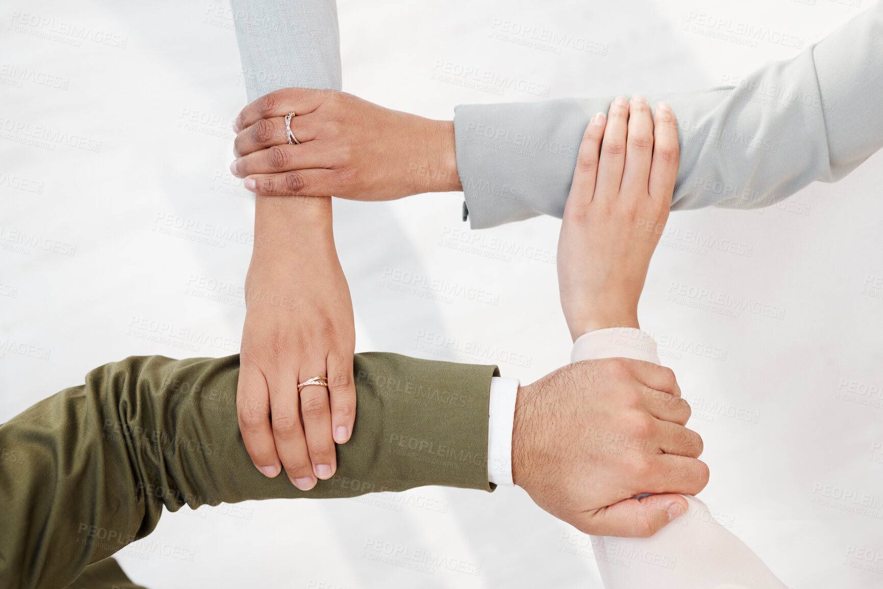 Buy stock photo Business people, hands together and unity in teamwork, collaboration or meeting for community trust above at office. Hand of group employee touching arms in team building, agreement or coordination