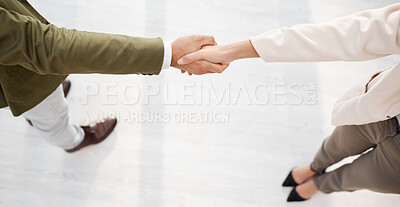 Buy stock photo Business people, handshake and partnership in meeting above for greeting, b2b or introduction at the office. Businessman and woman shaking hands in agreement, deal or collaboration at the workplace