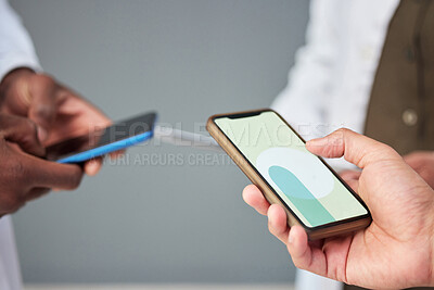 Buy stock photo Business people, hands and phone screen for networking, communication or sharing information at the office. Mockup of group or community holding mobile smartphone for app, social media or data sync