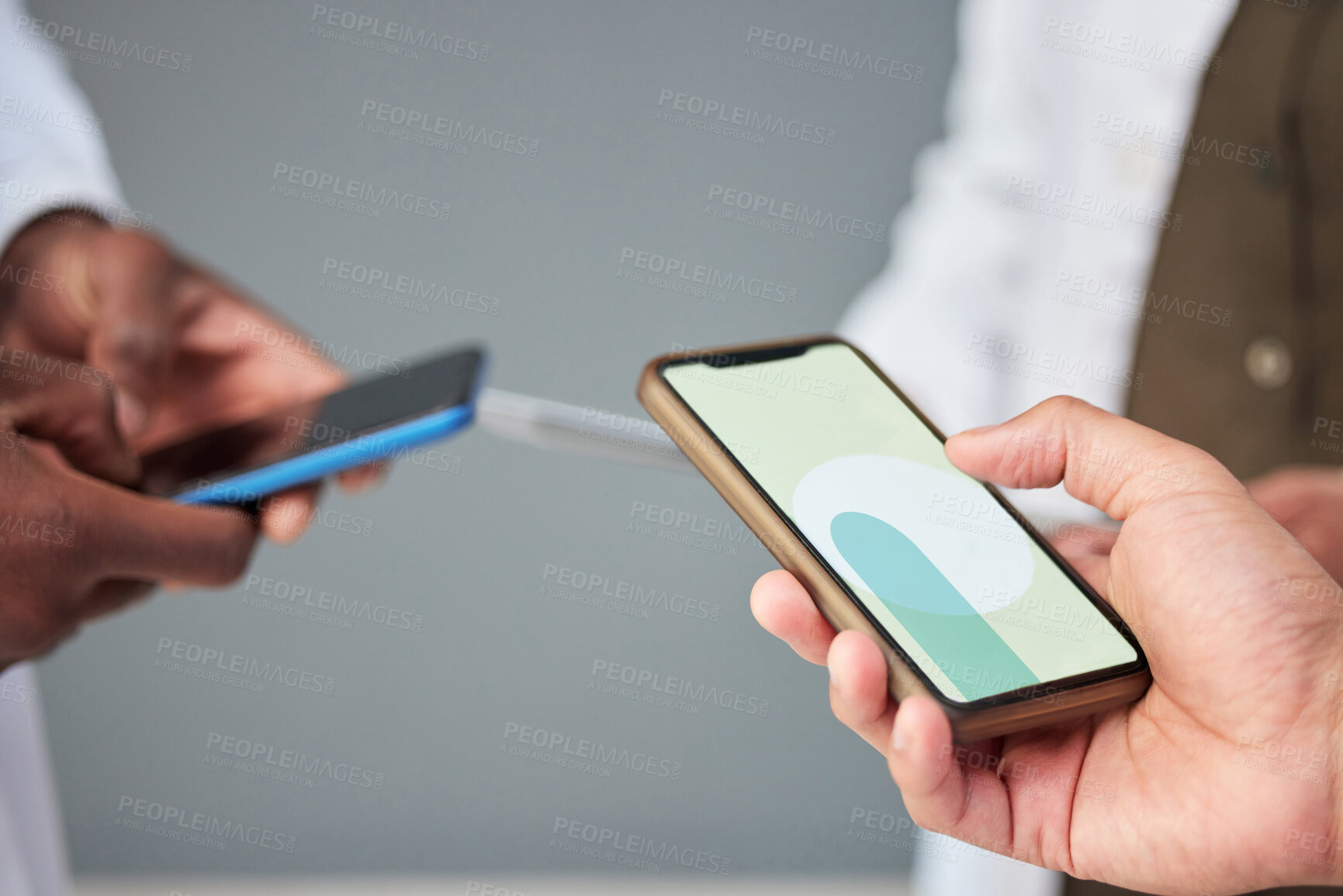 Buy stock photo Business people, hands and phone screen for networking, communication or sharing information at the office. Mockup of group or community holding mobile smartphone for app, social media or data sync