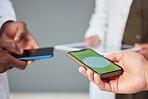 Hand, phone and data sharing with business people networking in an office while standing in a huddle. Mobile, information technology and communication with an employee team connecting to a database