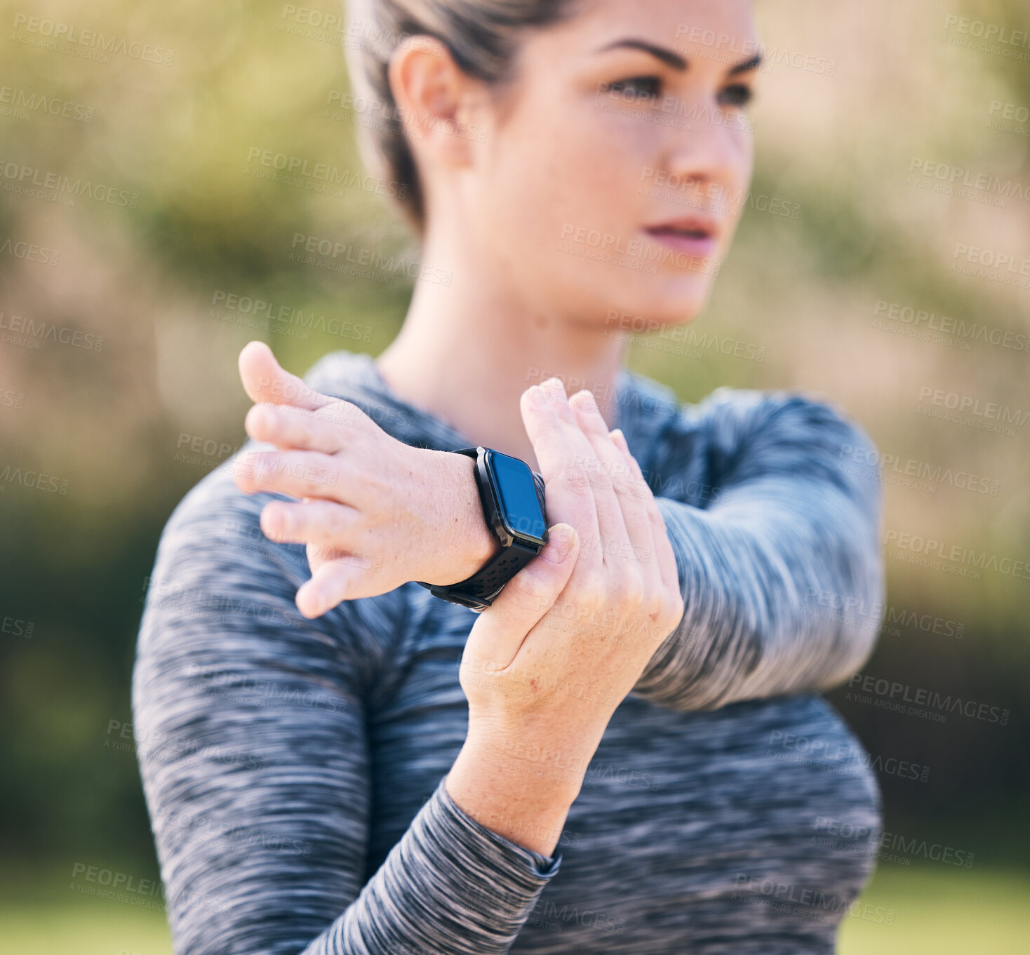 Buy stock photo Serious, woman and stretching arms for exercise, training and sports in park. Focused female athlete warm up in workout, performance and fitness outdoors in nature, garden and muscle power for cardio