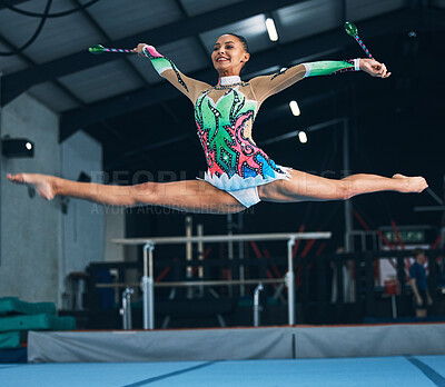 Buy stock photo Sports, gymnastics and woman jumping with a ribbon in a professional gym or arena for training. Fitness, routine and female athlete gymnast doing a trick while practicing for competition or challenge