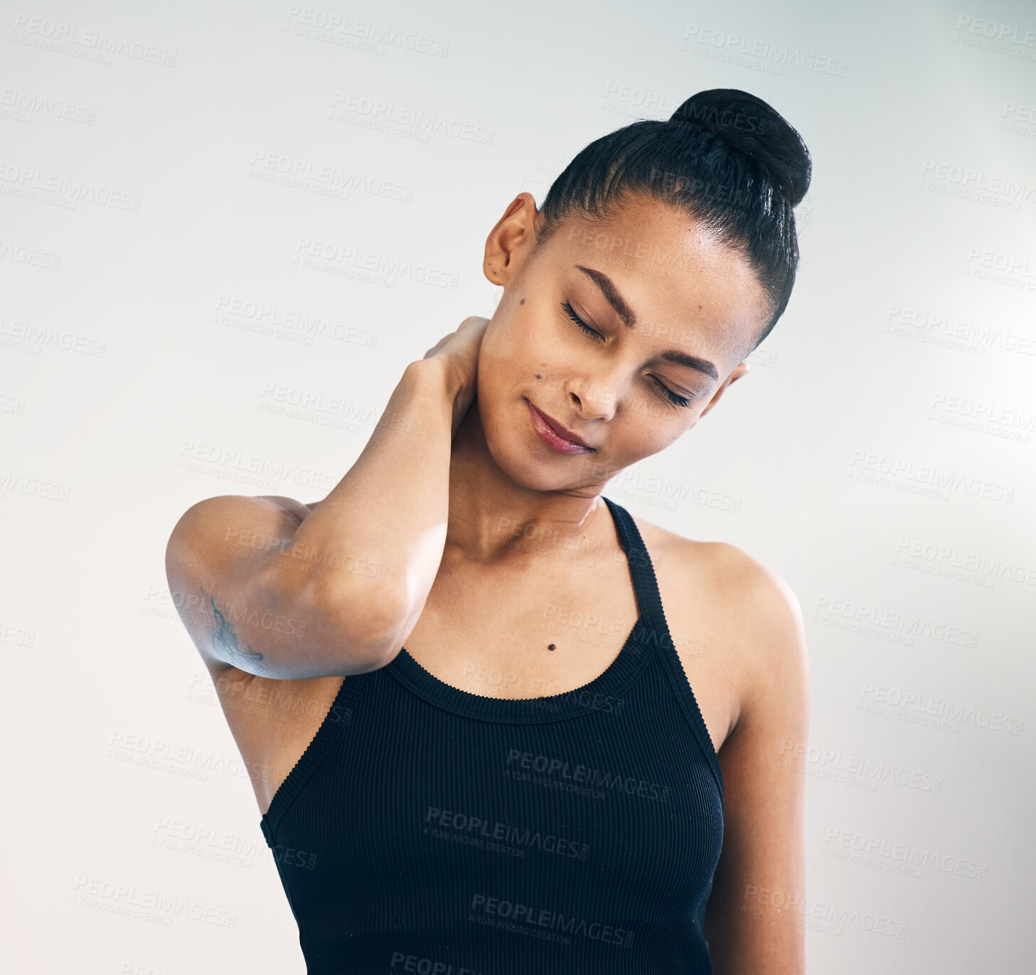 Buy stock photo Fitness, injury and woman with neck pain in studio during yoga routine against grey background. Spine, problem and girl suffering from injured muscle, arthritis or shoulder strain after workout run