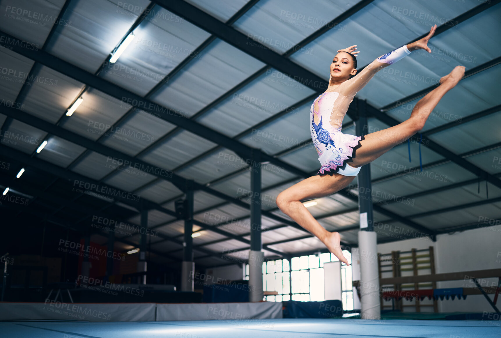 Buy stock photo Dance, jump and a woman in gymnastics practice, artistic hobby and competition for sport. Fitness, creative and a female gymnast practicing a routine, jumping and dancing for a sports performance