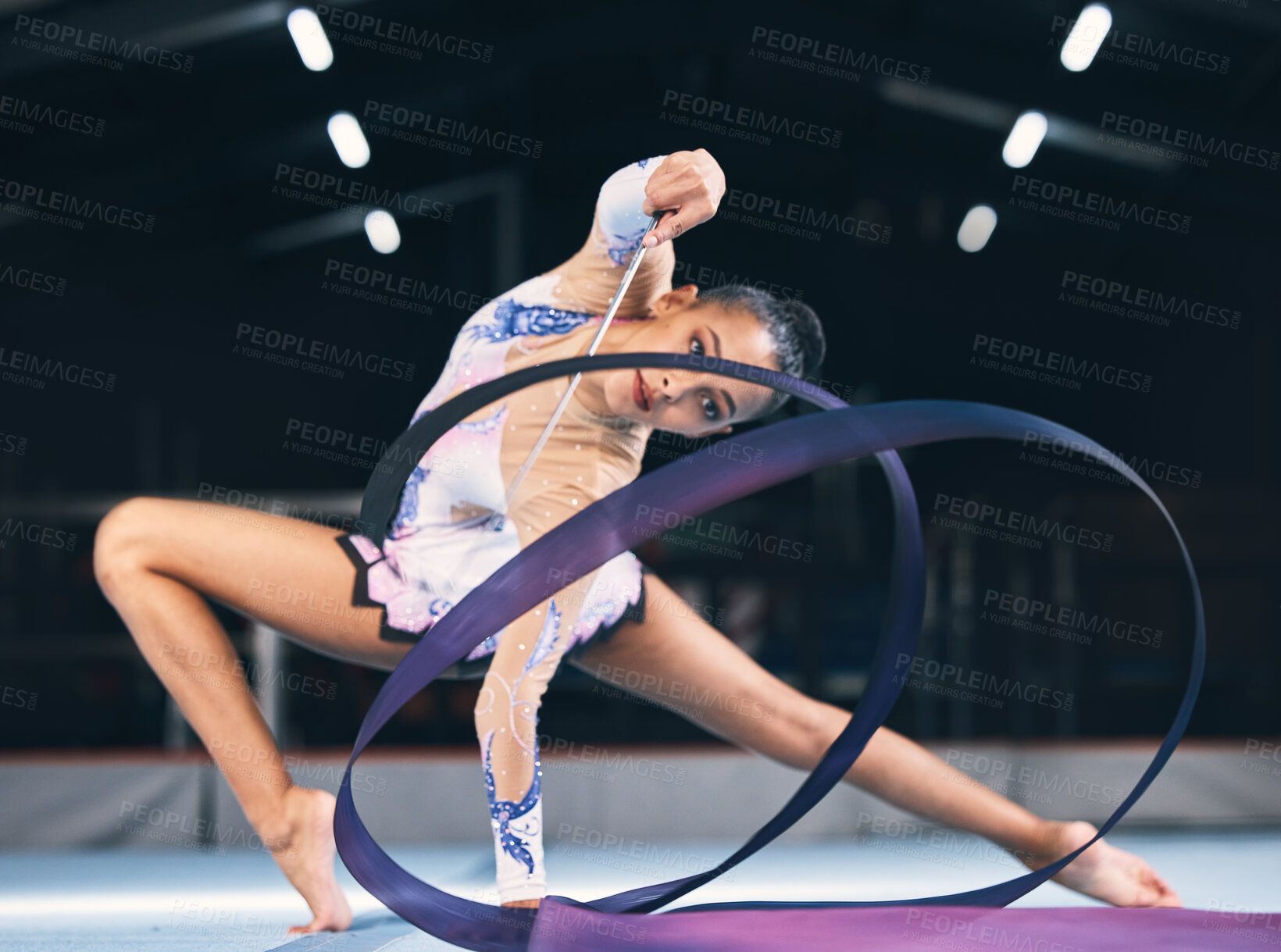 Buy stock photo Flexible woman, ribbon gymnastics and dancer in performance, sports competition and action show. Female, rhythmic movement and dancing athlete with creative talent, balance and moving with agility 