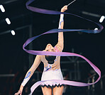 Ribbon gymnastics, flexible woman and dancing in performance, training and competition from the back. Female dancer, rhythmic movement and elegant action of creative talent, sports and concert event