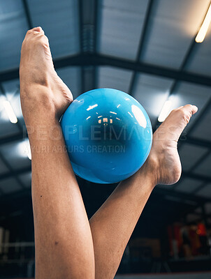 Gymnastics, woman and feet with ball for competition, dance practice and sports training. Closeup of barefoot female gymnast, balance and equipment for agility, creative skill or performance in arena