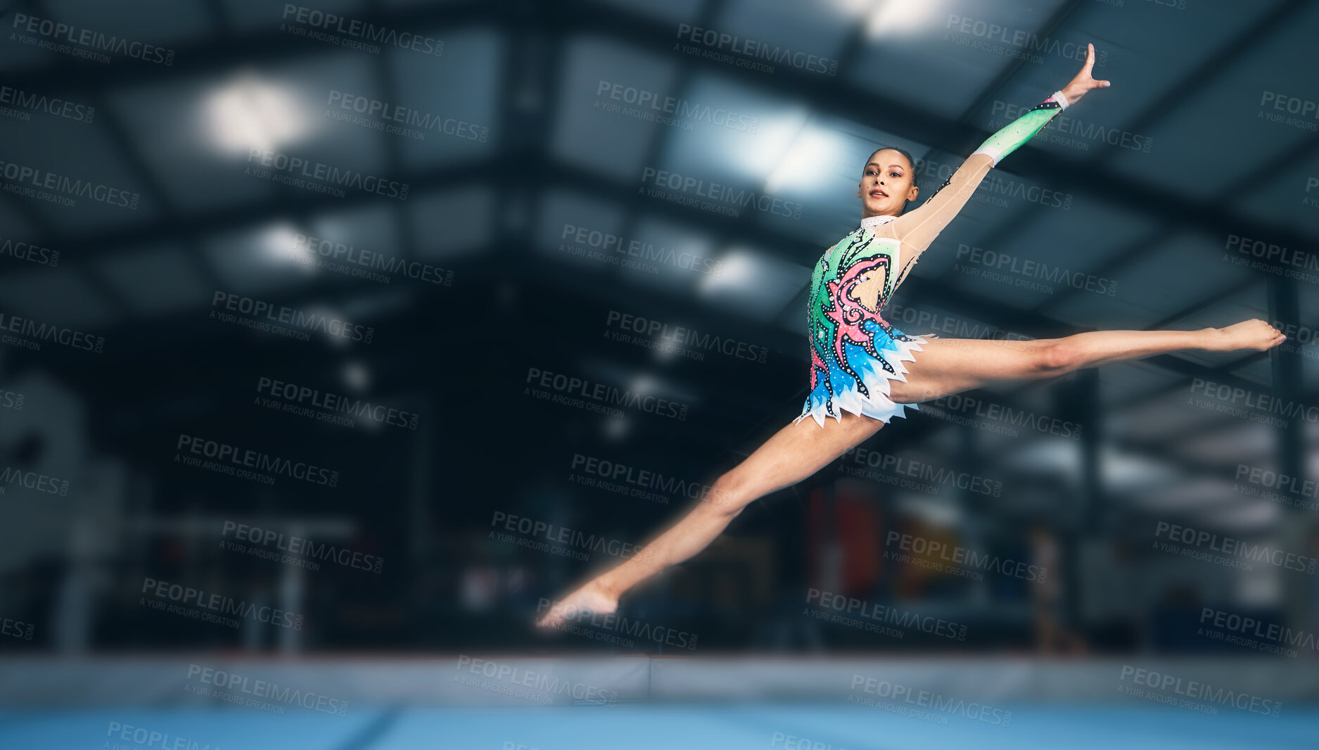 Buy stock photo Gymnastics, fitness and woman in arena jumping for sports competition, exercise and training with mockup space. Sports, movement and jump, professional gymnast with form and balance in performance.