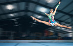 Fitness, gymnastics and girl in arena jumping for competition sport, exercise and training with mockup space. Sports, movement and jump, professional woman gymnast in form and balance in performance.