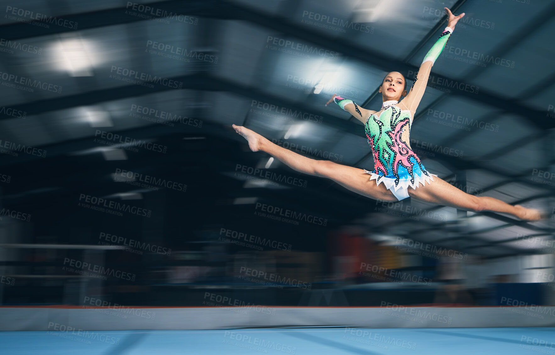 Buy stock photo Fitness, gymnastics and girl in arena jumping for competition sport, exercise and training with mockup space. Sports, movement and jump, professional woman gymnast in form and balance in performance.