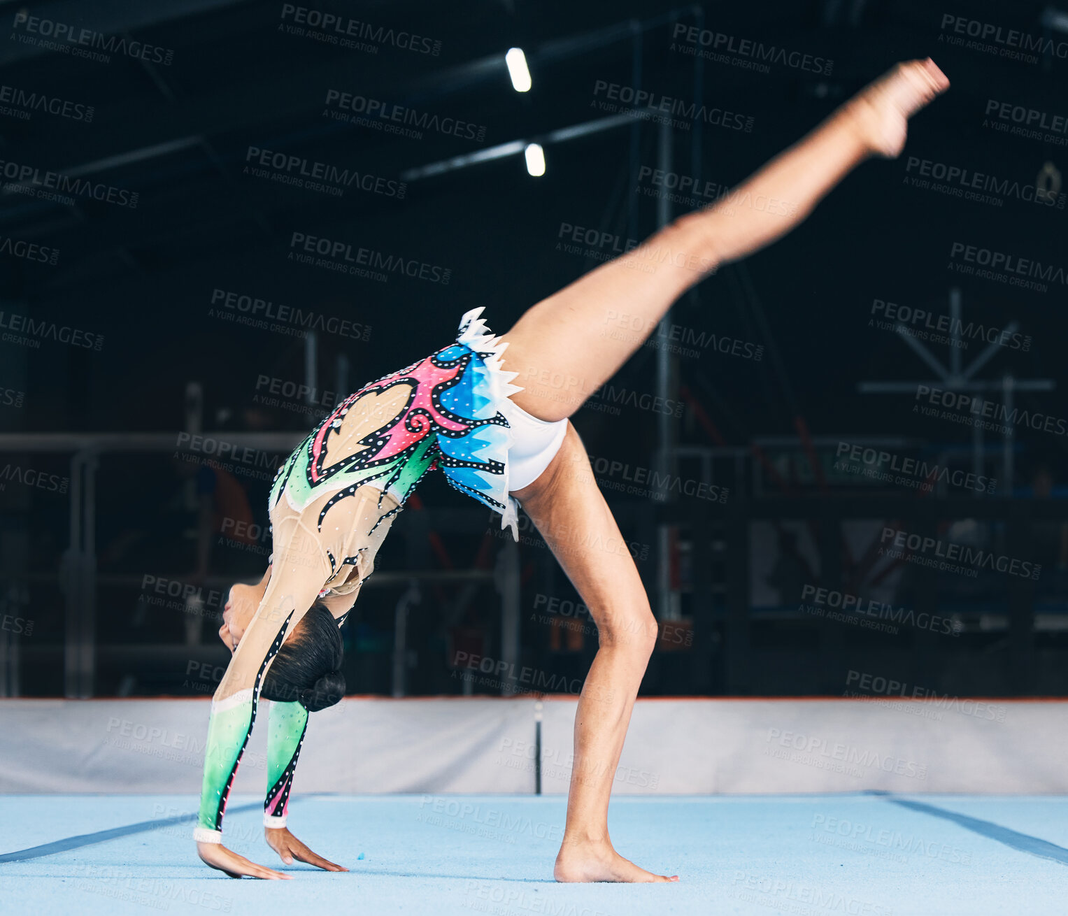 Buy stock photo Woman, gymnastics and handstand for flexible performance, body stretching and dance in sports arena. Female, rhythmic movement and balance upside down in talent show, competition or agility challenge