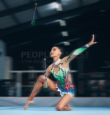 Woman, gymnast and dance sticks with balance and focus in a gym for dancing performance art. Exercise, training and sports competition of an athlete with moving for show for fitness and dancer sport