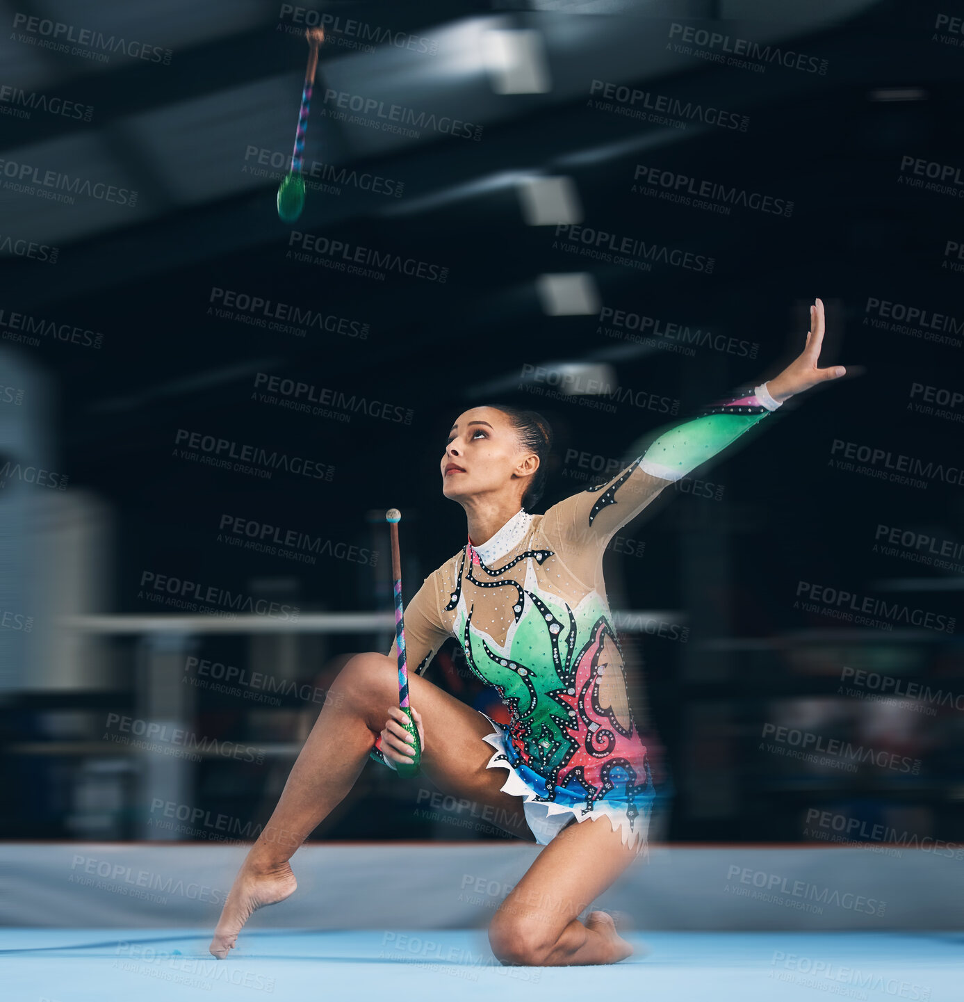 Buy stock photo Woman, gymnast and dance sticks with balance and focus in a gym for dancing performance art. Exercise, training and sports competition of an athlete with moving for show for fitness and dancer sport