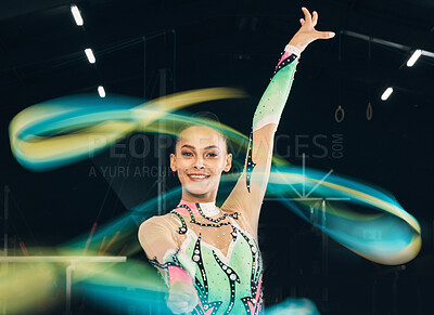 Buy stock photo Ribbon gymnastics, happy woman and portrait of motion, dancing performance and competition in dark arena. Female dancer, rhythmic movement and solo routine of creative talent, sports concert or smile