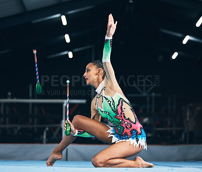 Woman, gymnast and dance stick toss with focus in a gym for dancing performance art. Exercise, training workout and sports competition of an athlete with moving for show for fitness and dancer sport
