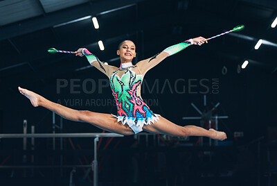 Buy stock photo Performance, gymnastics and female jumping with a ribbon in a professional gym or arena for training. Sports, routine and woman athlete gymnast doing a trick practicing for competition or challenge.