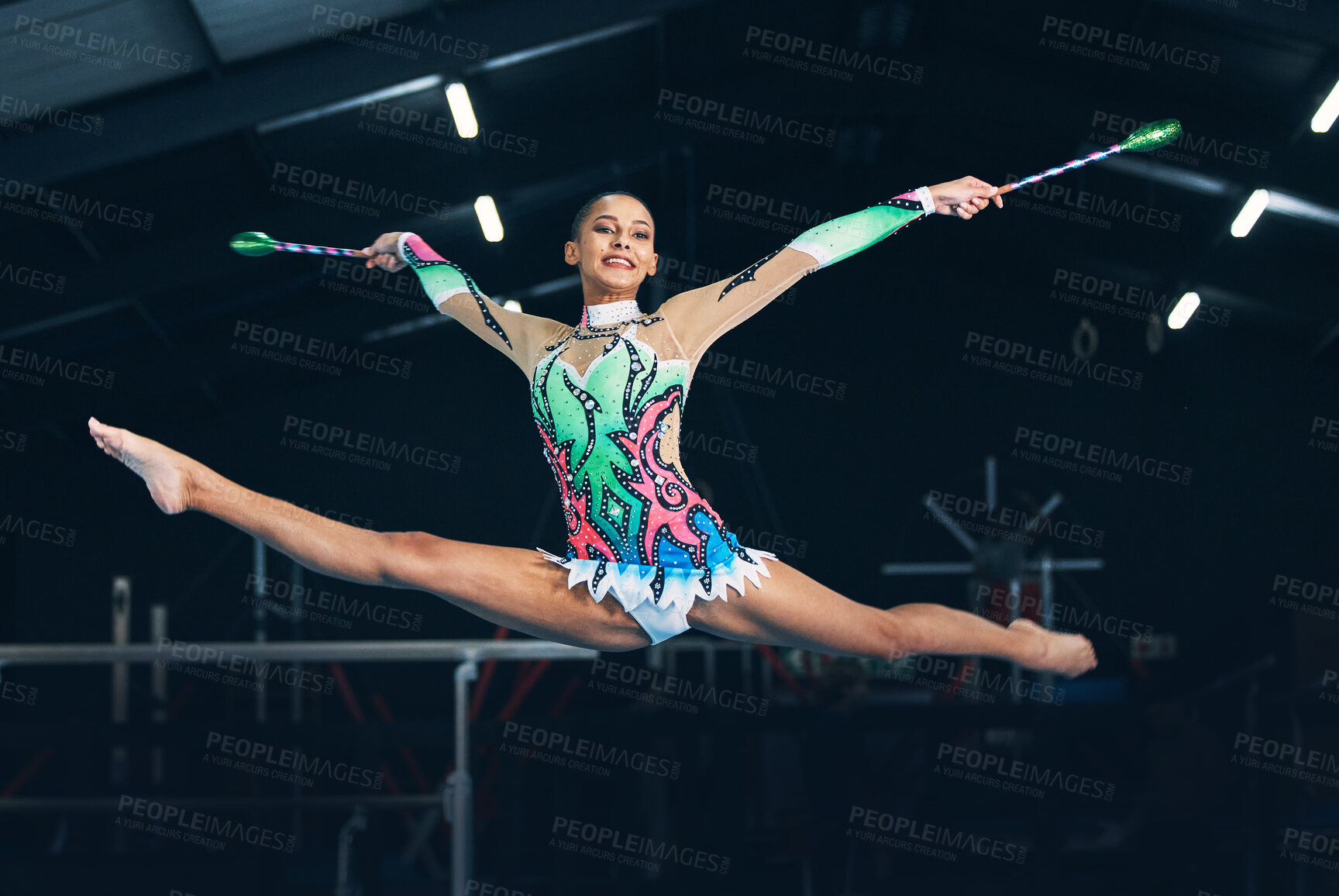 Buy stock photo Performance, gymnastics and female jumping with a ribbon in a professional gym or arena for training. Sports, routine and woman athlete gymnast doing a trick practicing for competition or challenge.