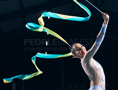 Buy stock photo Ribbon gymnastics, happy woman and portrait of dancer in performance, training show and competition in dark arena. Female, rhythmic movement and smile for action, creative talent and sports concert 