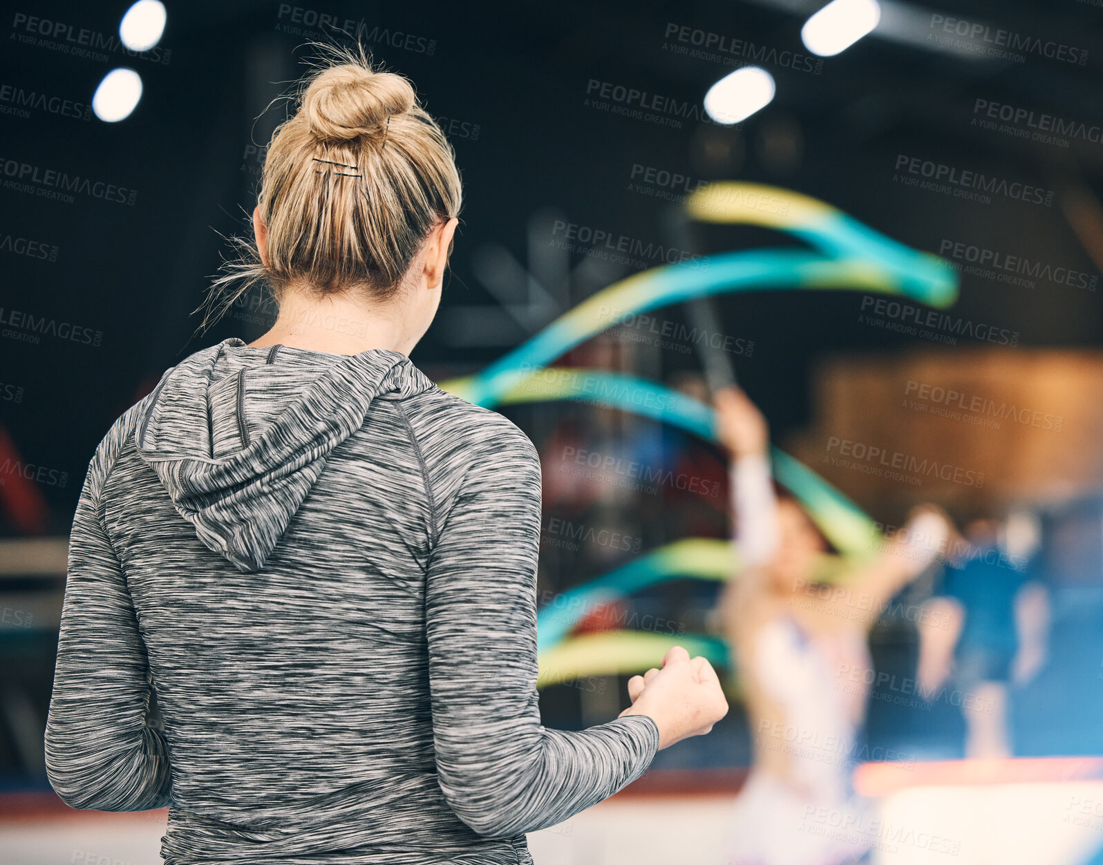 Buy stock photo Coaching, gymnastics and cheering with woman in stadium for training, fitness and teaching. Celebration, sports and workout practice with coach and acrobat for performance, flexibility and show