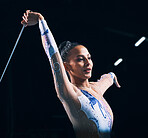 Ribbon gymnastics, woman and performance of dancer in talent show, training and competition in dark arena. Female athlete, rhythmic movement and action of creative talent, sports concert and dancing 