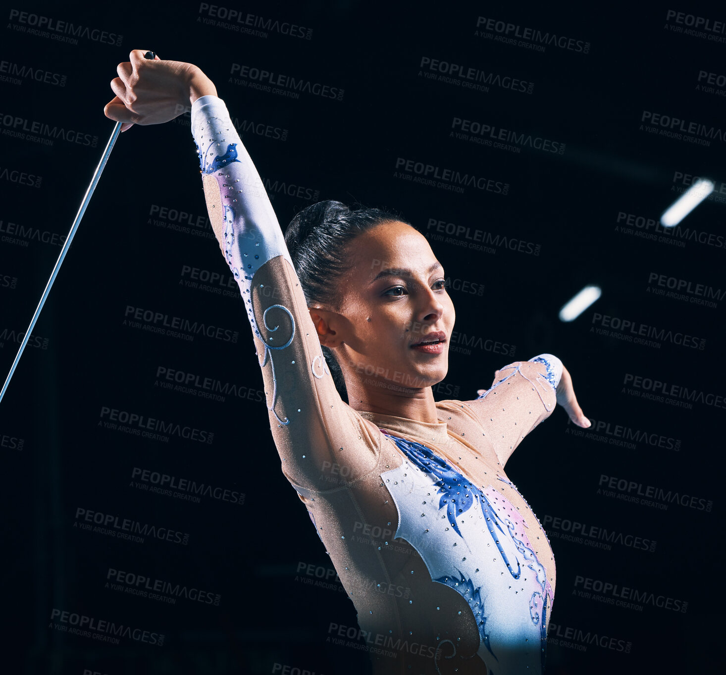 Buy stock photo Ribbon gymnastics, woman and performance of dancer in talent show, training and competition in dark arena. Female athlete, rhythmic movement and action of creative event, sports concert and dancing 