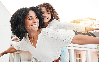 Buy stock photo Happy, mother and carrying flying girl on back in home garden for family bonding, quality time or playing game outdoors. Love, airplane or mom piggyback child with smile on summer vacation or weekend