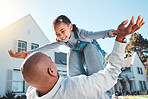 Family, happy and father lift girl relax in home garden for bonding, quality time and playing outdoors. Love, new house and dad with child flying in air smile on summer vacation, weekend and holiday