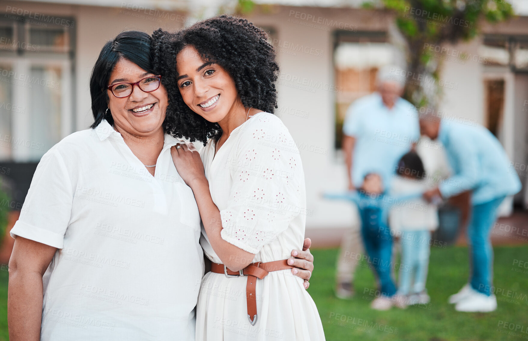 Buy stock photo Mother, daughter and family hug outside a home or house feeling happy and excited together and bonding. Love, care and people embrace for support, hugging and bonding for happiness or unity