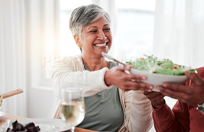 Buy stock photo Family dinner, senior woman and salad of a happy female with heathy food in a home. Celebration, together and people with unity from eating at table with happiness and a smile in a house giving meal