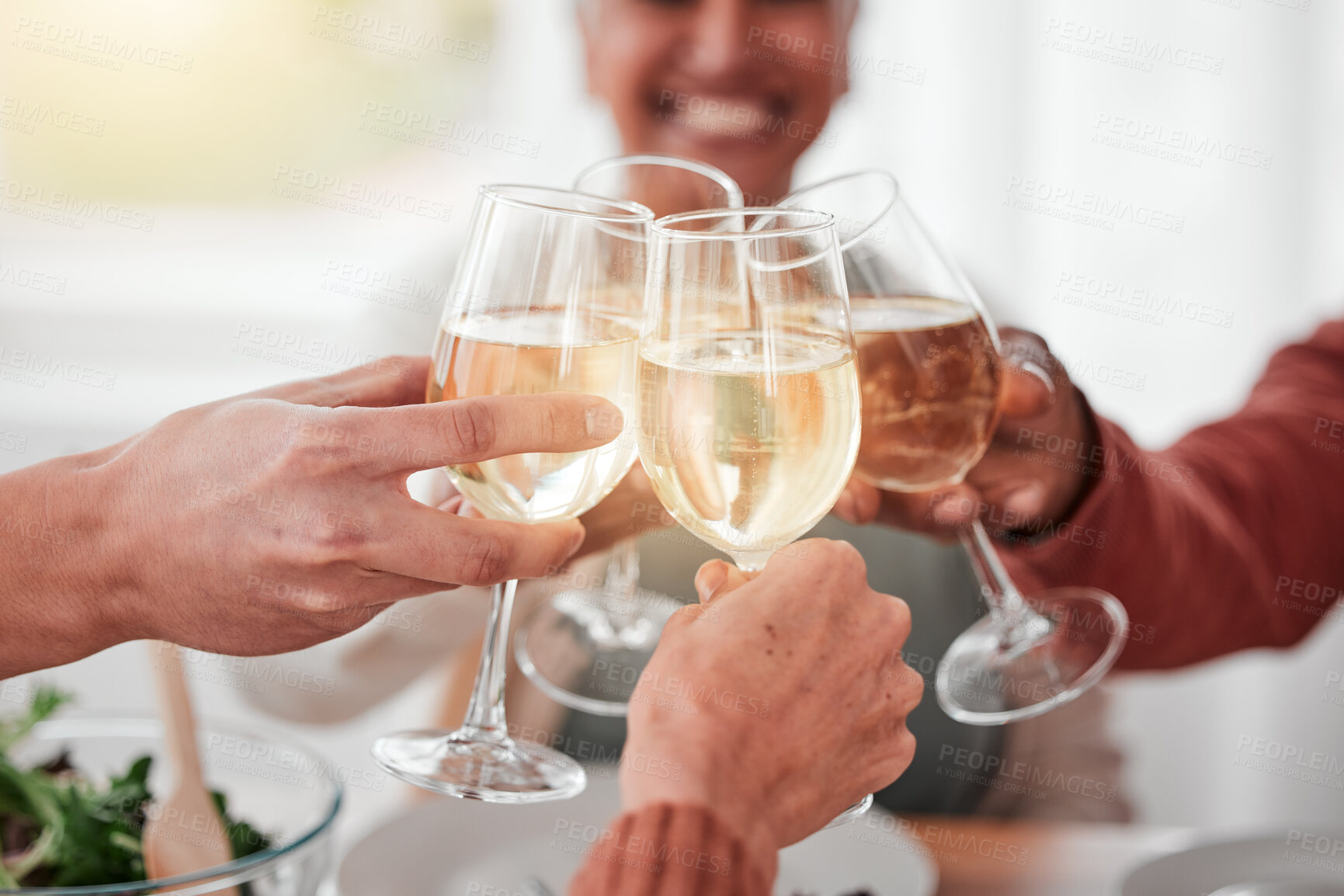 Buy stock photo People, hands and cheers for happy dinner, fine dining or celebration for meal or friendship together. Hand of family or friends toasting by table for food, drink or bonding in celebration at home