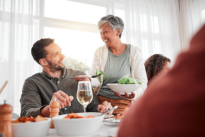 Buy stock photo Family, dinner and party with happiness while eating together, love and food with celebration and holiday. Man with senior woman, relationship and hungry people with meal, happy and carefree