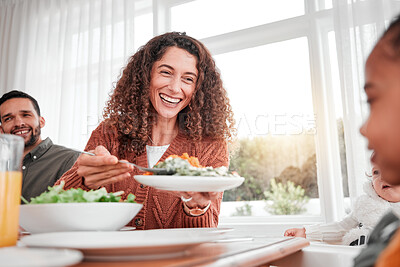 Buy stock photo Family dinner, happy woman and salad with children at home for nutrition. Celebration, together and people with kids eating at table with happiness and a smile in a house giving lunch on plate