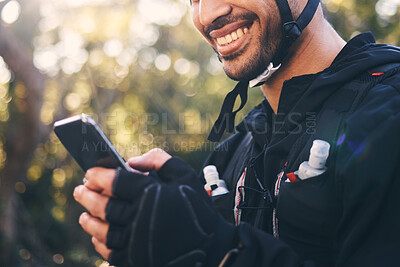 Buy stock photo Sports, man and phone outdoor for cycling, mountain biking or workout and smile in nature. Male person in forest with smartphone in hands for communication, gps travel app or fitness with safety gear