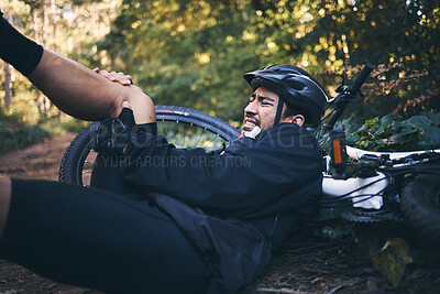 Buy stock photo Man, cycling injury and leg or knee pain outdoor on mountain bike in nature. Athlete person on forest ground for fitness exercise or training workout accident, crash or fall with helmet and bicycle