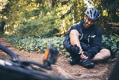 Buy stock photo Man cycling, leg injury and pain outdoor on mountain bike or bicycle in nature. Athlete cyclist person on ground in forest for fitness exercise, sports training or workout accident, crash or fall