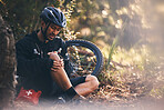 Man, cycling and outdoor with leg or knee injury in nature for sports, exercise or training on mountain bike. Athlete person with bicycle and first aid for fitness workout accident or fall in forest