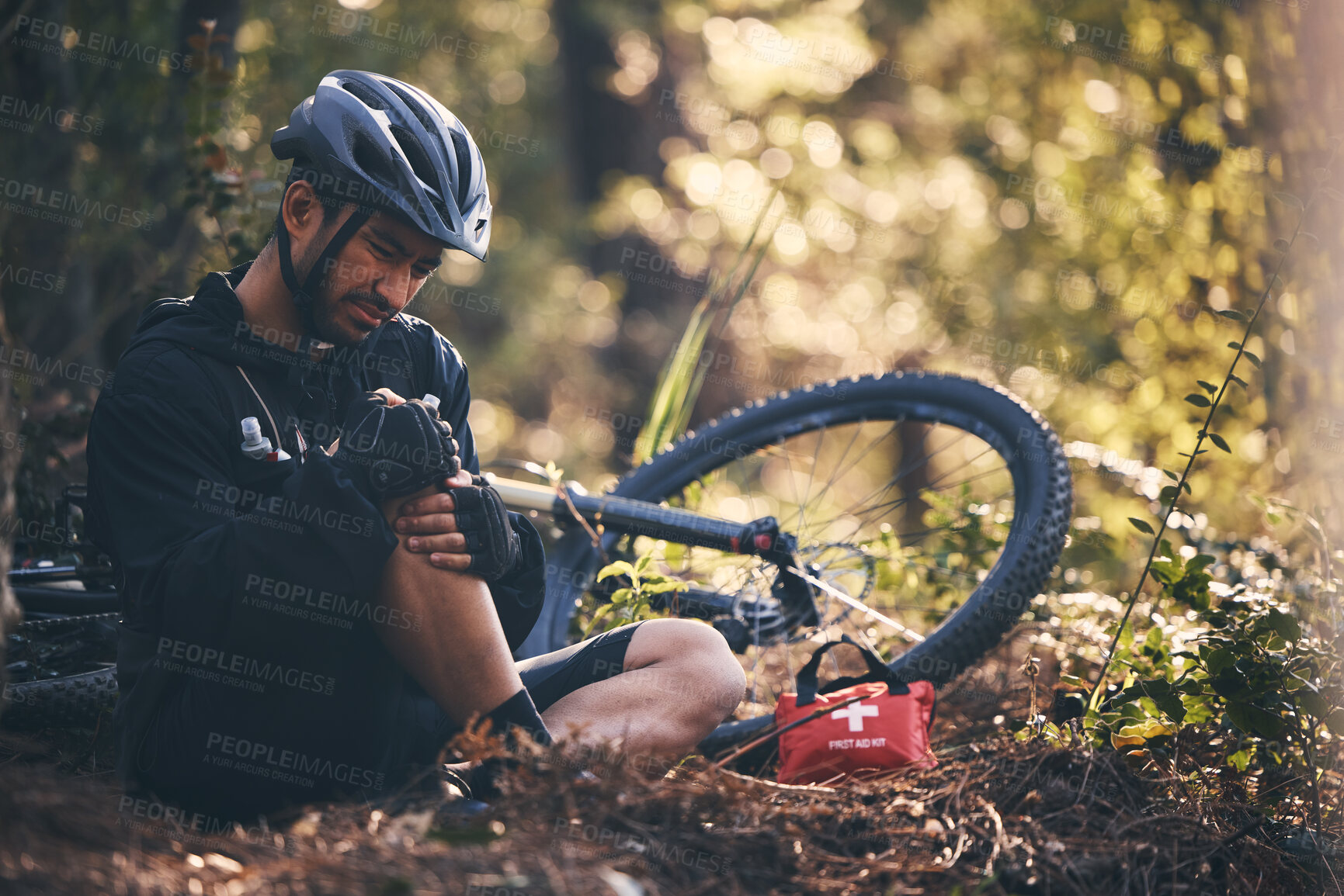 Buy stock photo Sports man, injury and first aid outdoor while cycling on mountain bike in nature with leg or knee pain. Athlete person on ground in forest for fitness exercise, training or workout accident or fall