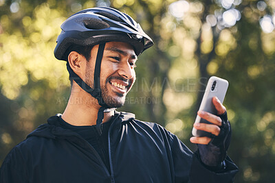 Buy stock photo Man, cycling and outdoor with a phone for communication in nature for sports, exercise or training app. Athlete male person with helmet and smile for fitness workout with smartphone for travel or gps