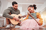 Family, children or fantasy band with a father and daughter playing music together on instruments at home. Kids, love or bonding with a man and girl child having fun in the living room of their house