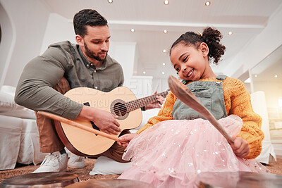 Buy stock photo Family, children or fantasy band with a father and daughter playing music together on instruments at home. Kids, love or bonding with a man and girl child having fun in the living room of their house