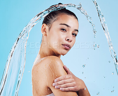 Buy stock photo Water drops, skincare and portrait of woman with health, wellness and hygiene isolated on blue studio background. Shower, dermatology and cosmetic beauty glow, model in skin care treatment or routine