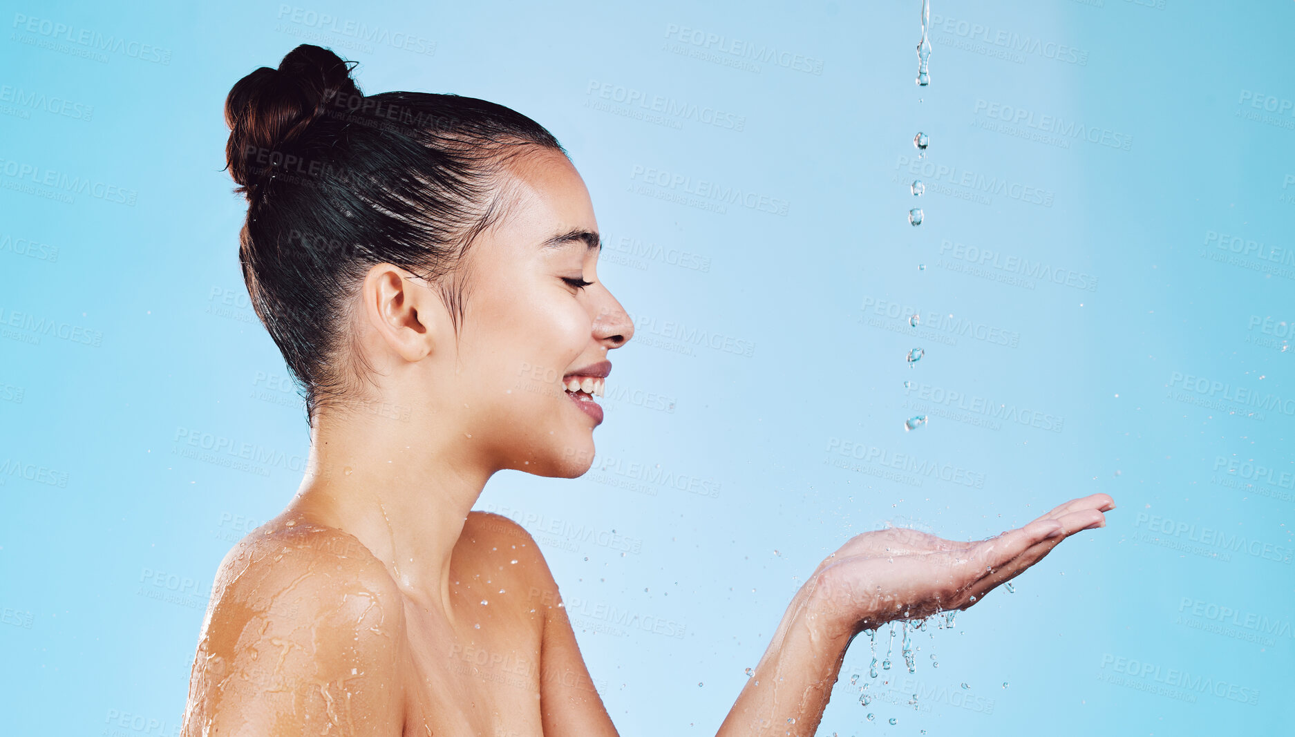 Buy stock photo Water drops, skincare and woman with mockup for health, wellness and hygiene isolated on blue studio background. Shower, dermatology and cosmetic beauty glow, model in skin care treatment or routine