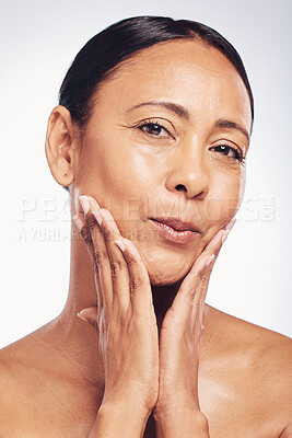 Buy stock photo Skincare, glow and the portrait of a mature woman isolated on a white background in a studio. Happy, anti aging and a beauty model touching glowing skin, feeling softness and clear complexion