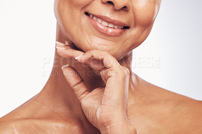 Buy stock photo Hand, mouth and beauty with a mature woman in studio for skincare, anti aging treatment or cosmetics. Skin, facial and wellness with a senior female touching her face for self care or hygiene closeup