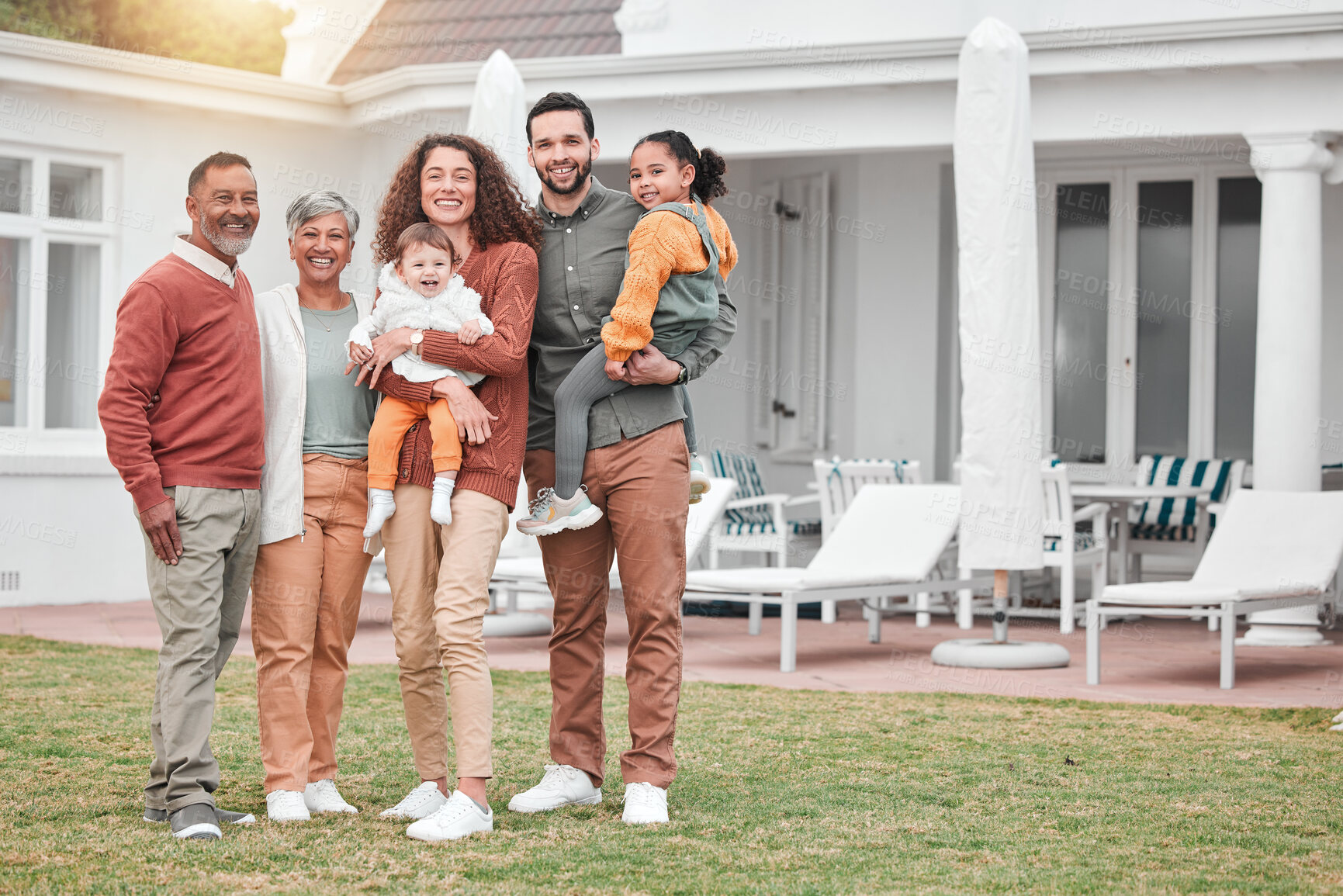 Buy stock photo Family, generations and happiness in portrait at holiday home, grandparents and parents with children on lawn. Men, women and kids, love and care in relationship and happy people smile on vacation