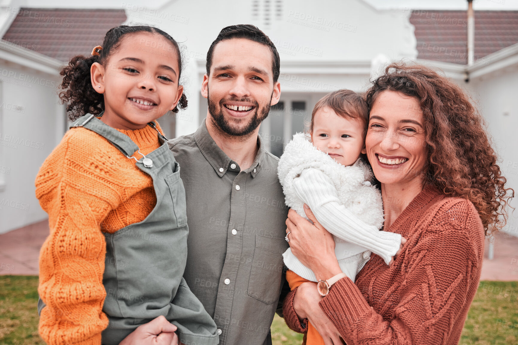 Buy stock photo New home, family and portrait couple with children bonding outside a house feeling excited and happiness. Smile, interracial and mother relax with children, kids and father together on vacation