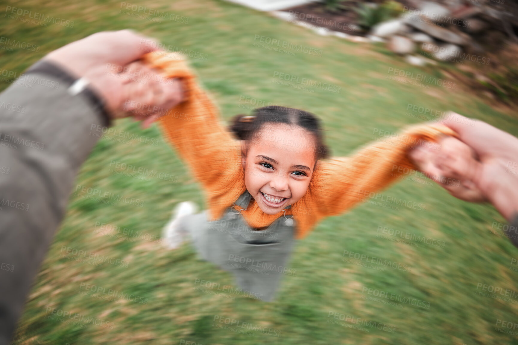 Buy stock photo Blur, happy and a child and father swinging, playing and bonding in the garden. Smile, playful and a little girl moving with energy during playtime with dad holding hands to swing in the backyard
