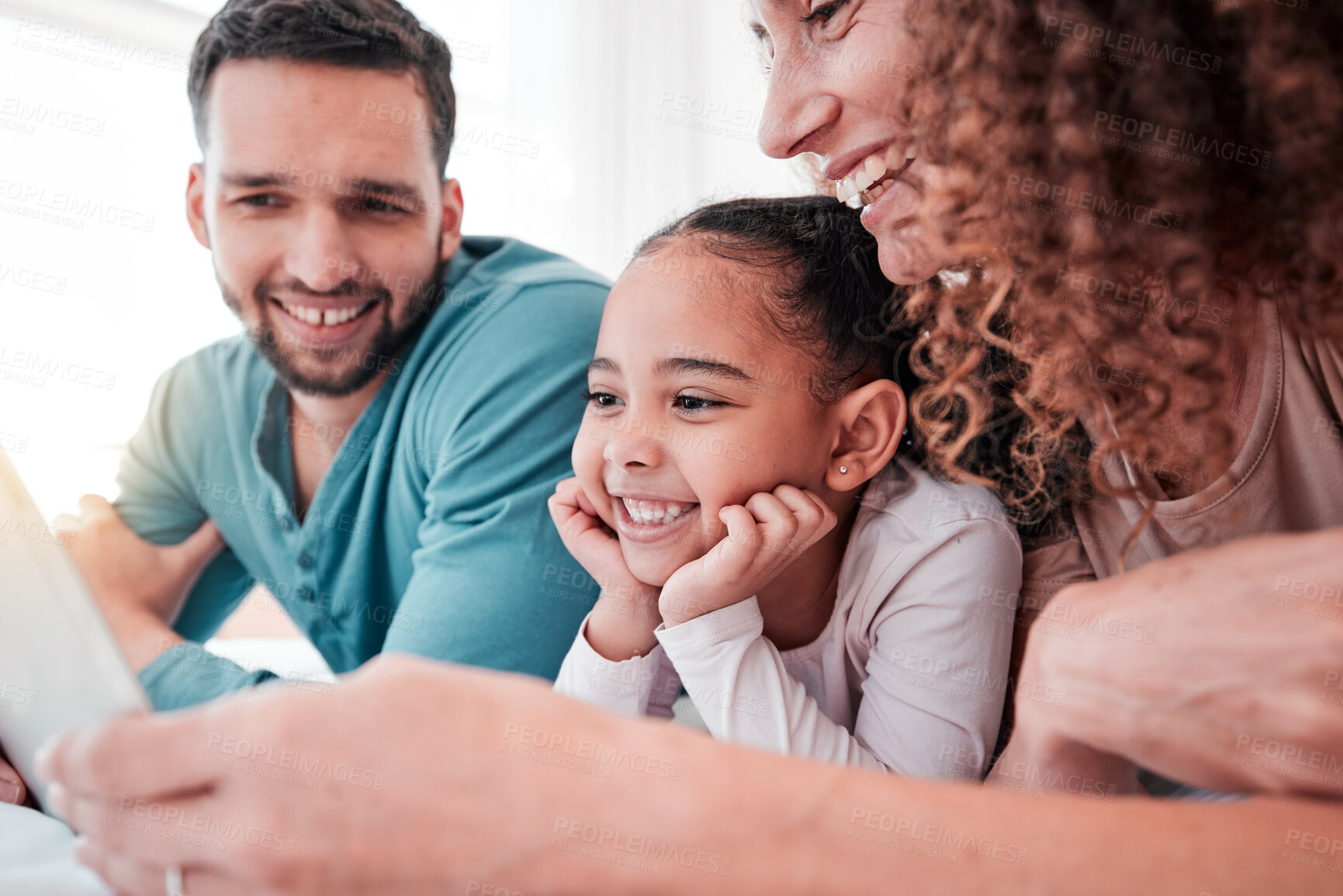 Buy stock photo Happy family on bed with tablet, kid and movies, streaming service for child development and educational video. Mom, dad and girl bonding in bedroom, happiness and smile with digital entertainment.