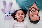 Portrait of dad, child and teddy bear on bed from above, bonding and love with play time to relax. Smile, happiness and man with kid together in bedroom of family home in morning or bedtime in Mexico